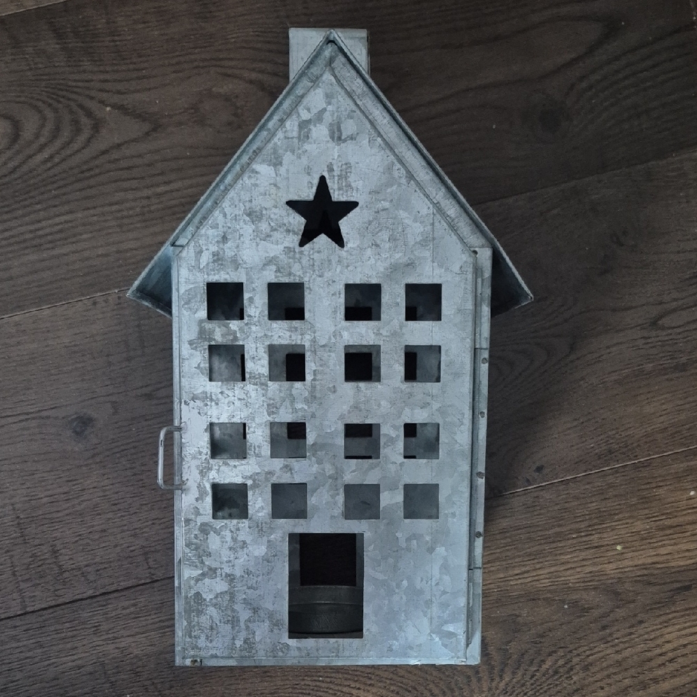 Metal House Lantern with Star Cutout, holds pillar candle